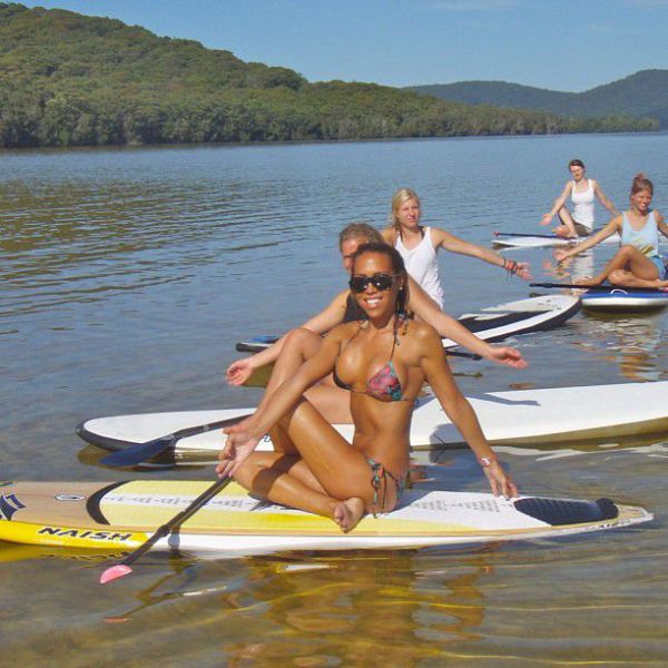 Surfboard Yoga Is a Fun New Form of Beach Exercise
